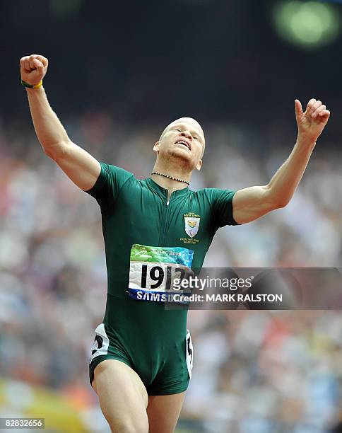 Hilton Langenhoven of South Africa celebrates after winning the final of the men's 200 metre T12 classification event at the 2008 Beijing Paralympic...