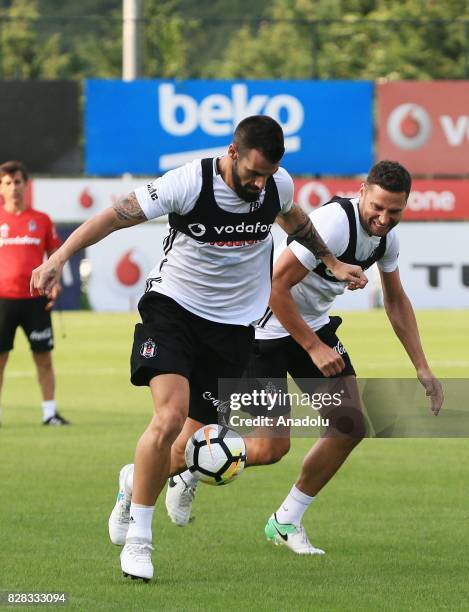 Alvaro Negredo and Dusko Tosic of Besiktas attend a training session ahead of the Turkish Spor Toto Super Lig new season match between Besiktas and...