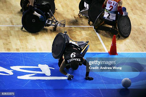 Manabu Tamura of Japan scores a try during the 7/8 classification match of the Mixed Wheelchair Rugby between China and Japan at Beijing Science and...