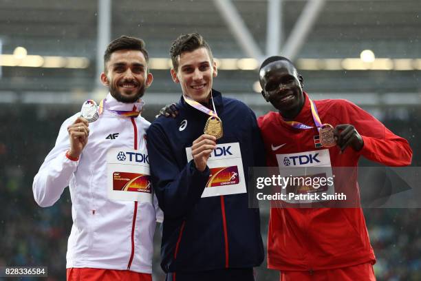 Adam Kszczot of Poland, silver, Pierre-Ambroise Bosse of France, gold, and Kipyegon Bett of Kenya, bronze, pose with their medals for the Men's 800...