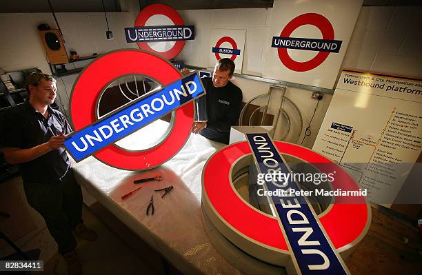 Workers at AJ Wells and Sons prepare London Underground 'roundel' signs on September 15, 2008 in Newport on the Isle of Wight, England. The famous...