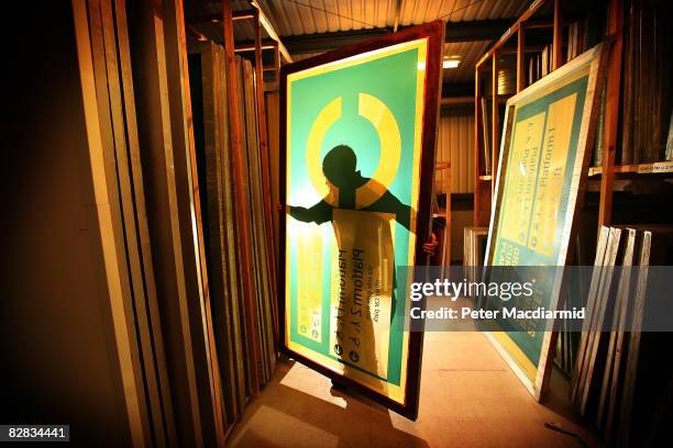 Worker carries a silk screen of a London Underground 'roundel' sign at AJ Wells and Sons on September 15, 2008 in Newport on the Isle of Wight,...