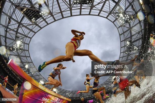 Spain's Irene Sanchez-Escribano jumps as she competes in the women's 3000m steeplechase athletics event at the 2017 IAAF World Championships at the...