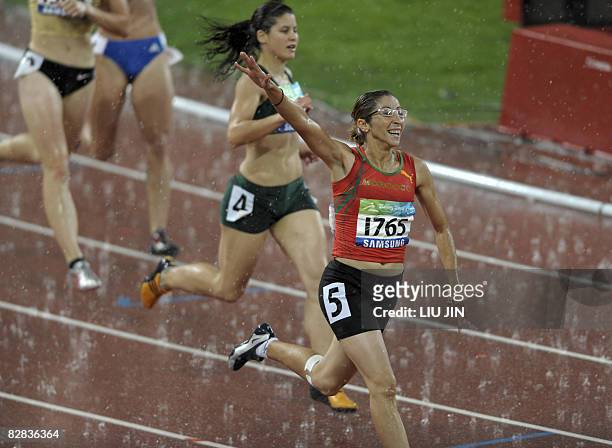 Sanaa Benhama of Morocco celebrates after winning women's 100m T13 during the 2008 Beijing Paralympic Games at the National Stadium in Beijing on...