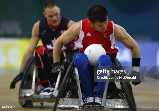 Alan Ash of Great Britain drives for goal during the Wheelchair Rugby match between Great Britain and Canada at the Beijing Science and Technology...