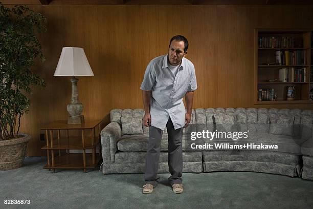 man looking at something suspiciously - amazing house stock pictures, royalty-free photos & images