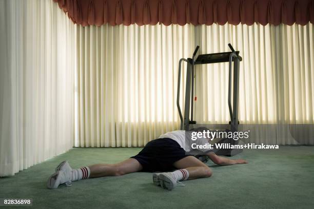 man collapsed on treadmill - fatigue full body stock-fotos und bilder