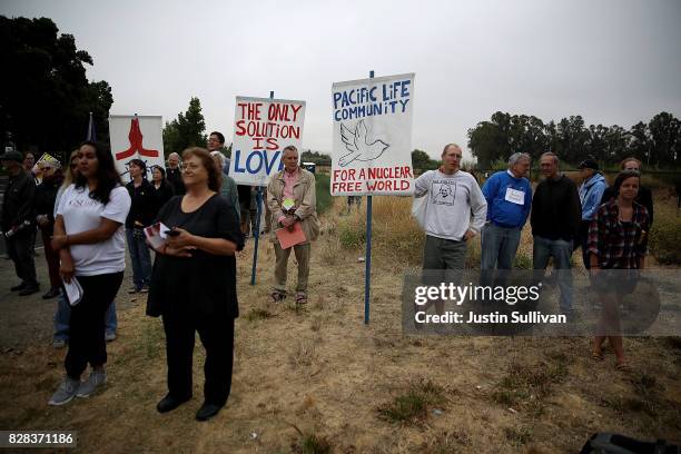 Protesters holds signs during a demonstration against nuclear weapons outside of the Lawrence Livermore National Laboratory on August 9, 2017 in...