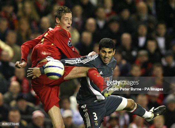Liverpool's Peter Crouch battles with Benfica's Cleber Beraldo Anderson for the ball during the UEFA Champions League second round, second leg match...