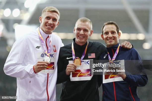 Piotr Lisek of Poland, silver, Sam Kendricks of the United States, gold, and Renaud Lavillenie of France, bronze, pose with their medals for the...