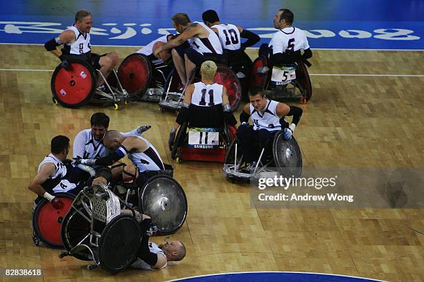Players of the United States celebrate after beating Australia in the final match of the Mixed Wheelchair Rugby at Beijing Science and Technology...