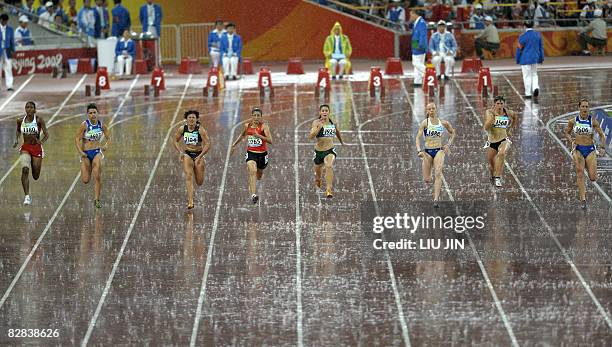 Sanaa Benhama of Morocco competes with other athletes in the women's 100m T13 final during the 2008 Beijing Paralympic Games at the National Stadium...