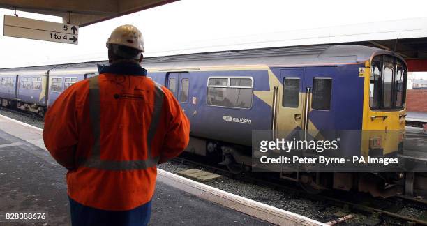 An engineer looks at the train on platform four of Blackpool North Station, Wednesday 15 March 2006, after ten people were injured when two trains...