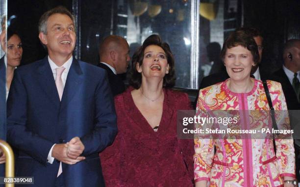 Britain's Prime Minister Tony Blair and his wife is greeted by New Zealand counterpart Helen Clark at the Town Hall in Auckland, Tuesday March 28...
