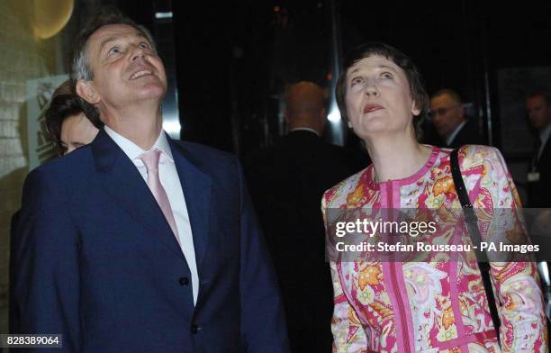 Britain's Prime Minister Tony Blair is greeted by his New Zealand counterpart Helen Clark at the Town Hall in Auckland, Tuesday March 28 2006, as he...