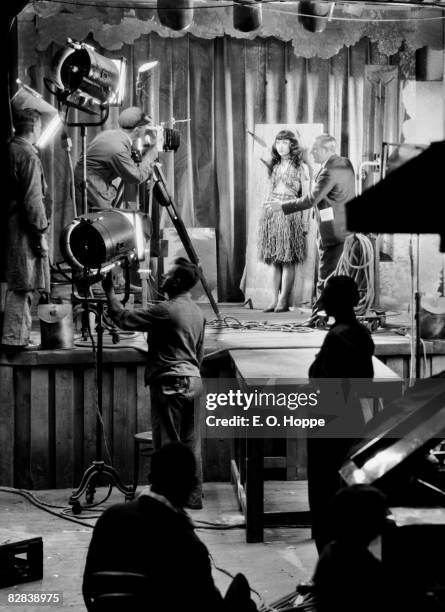 Chinese-American film actress, Anna May Wong as a knife-thrower's assistant on set at UFA Studios, Berlin, 1928.