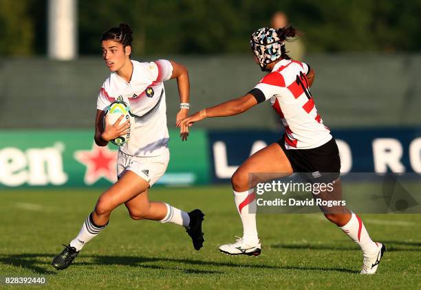 Montserrat Amedee of France hands off the tackle of Makiko Tomita of Japan during the Women's Rugby World Cup 2017 match between France and Japan on...