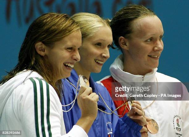 Scotland's Caitlin McClatchley celebrates winning the Gold medal in the Women's 200m Freestyle with Silver medal winner Libby Lenton from Australia...