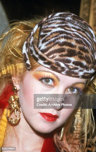 American pop singer Cyndi Lauper wearing a leopard print hat during the presentation of her gold record for her album, 'She�s So Unusual', Austria,...