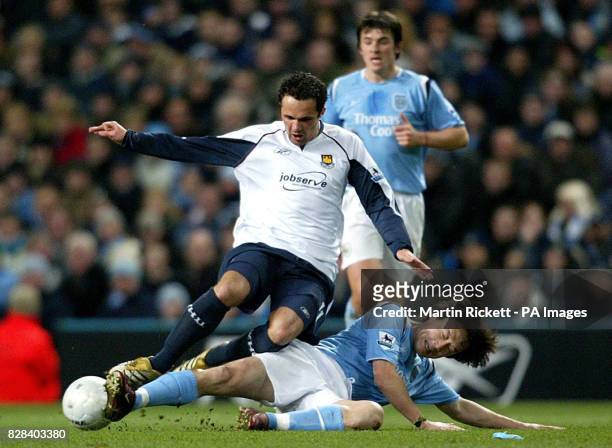 West Ham United's Matthew Etherington is tackled by Manchester City's Sun Jihai during the FA Cup sixth round match at the City of Manchester...
