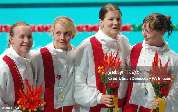 England's 4x100m medley relay team Melanie Marshall, Francesca Halsall, Kate Haywood and Terri Dunning celebrate winning the silver medal during the...