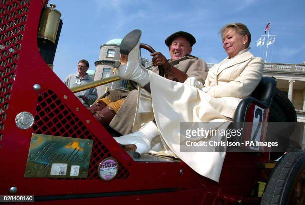 Lady Susie Moss with her husband Sir Stirling Moss, dressed in period costume, on a 1907 Renault at Goodwood House near Chichester, West Sussex...