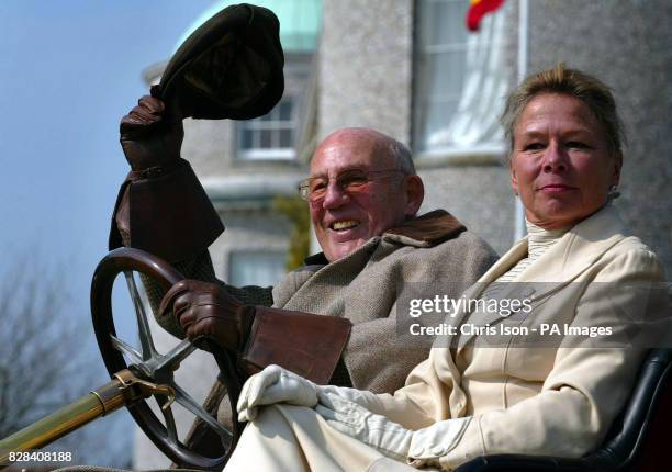 Dressed in period costume, Sir Stirling and Lady Susie Moss at the wheel of a 1907 Renault at Goodwood House near Chichester, West Sussex Thursday...