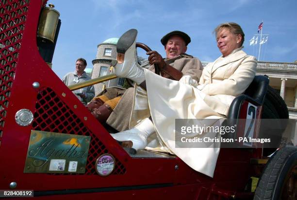 Lady Susie Moss with her husband Sir Stirling Moss, dressed in period costume, on a 1907 Renault at Goodwood House near Chichester, West Sussex...
