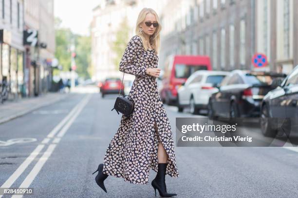 Juliane Diesner wearing Ganni dress with floral print, Chanel bag, Balenciaga boots on August 09, 2017 in Copenhagen, Denmark.