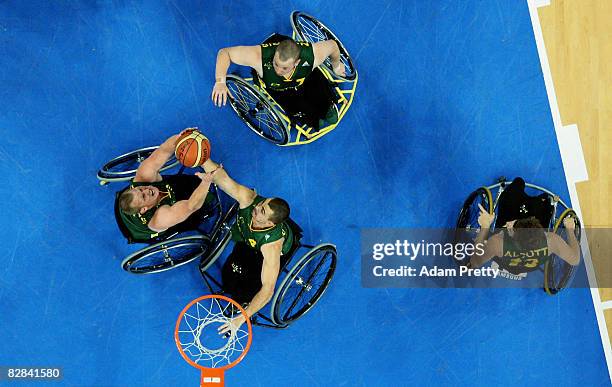 Troy Sachs and Justin Everson of Australia contest for a rebound during the Gold Medal Wheelchair Basketball match between Australia and Canada at...