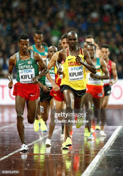 Aron Kifle of Eritrea and Jacob Kiplimo of Uganda during heat one of the Men's 5000 Metres heats during day six of the 16th IAAF World Athletics...