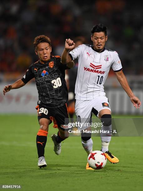 Hotaru Yamaguchi of Cerezo Osaka and Shota Kaneko of Shimizu S-Pulse compete for the ball during the J.League J1 match between Shimizu S-Pulse and...