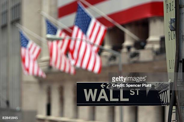 Wall St. Sign next to the New York Stock Exchange September 16, 2008 in New York City. U.S. Stocks continued to drop Tuesday morning for the second...