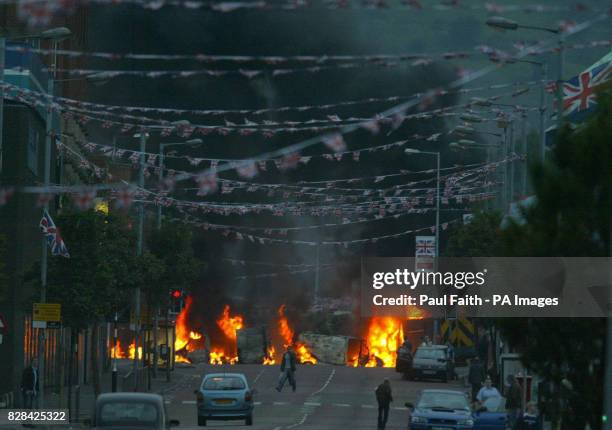 Burning vechicles on the Shankill road in Belfast after clashes that saw police and soldiers attacked with petrol bombs and reports of blast bombs...