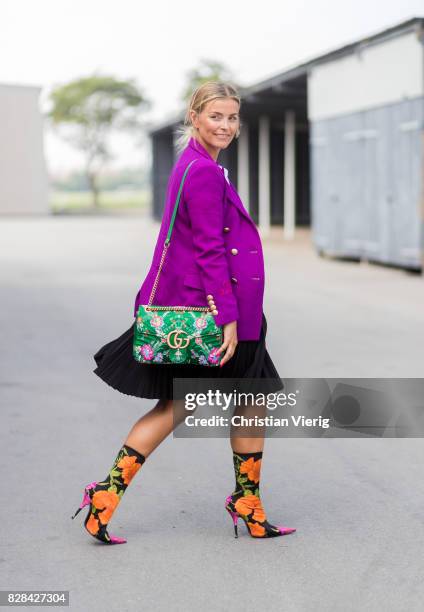 Janka Polliani wearing purple blazer, Balenciaga boots, Gucci bag outside By Malene Birger on August 09, 2017 in Copenhagen, Denmark.