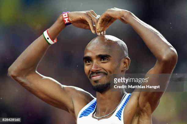 Mohamed Farah of Great Britain reacts by doing the mobot as he celebrates after competing in the Men's 5000 Metres heats during day six of the 16th...