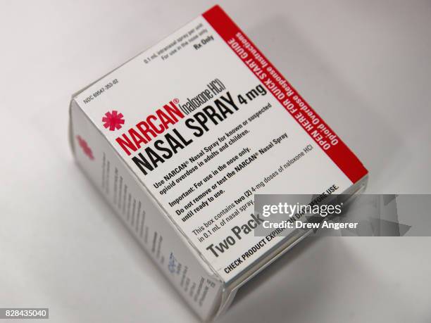 In this photo illustration, a package of NARCAN nasal spray sits on the counter at a Walgreens pharmacy, August 9, 2017 in New York City. Starting on...