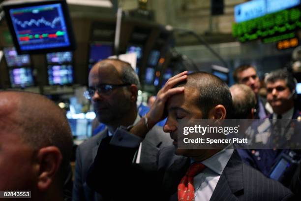 Traders work on of the floor of the New York Stock Exchange September 16, 2008 in New York City. The Federal Open Market Committee met today and...