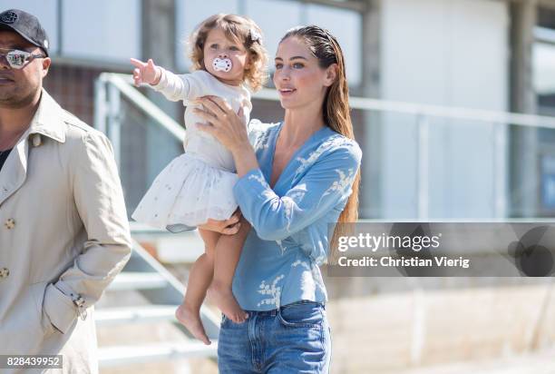 Model with her child outside By Malene Birger on August 09, 2017 in Copenhagen, Denmark.