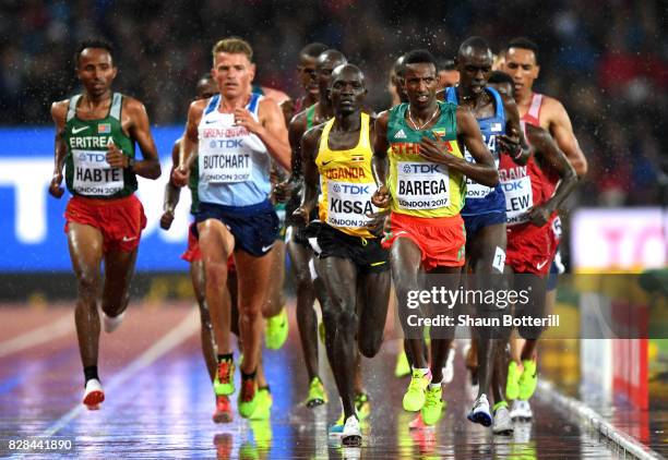 Selemon Barega of Ethiopia leads from Stephen Kissa of Uganda and Andrew Butchart of Great Britain during heat two of the Men's 5000 Metres heats...