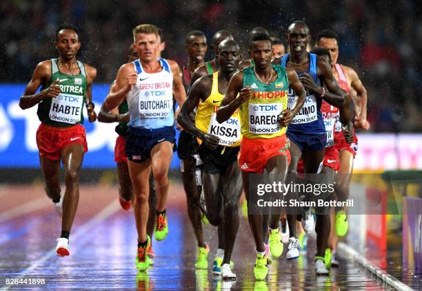 Selemon Barega of Ethiopia leads from Stephen Kissa of Uganda and Andrew Butchart of Great Britain during heat two of the Men's 5000 Metres heats...