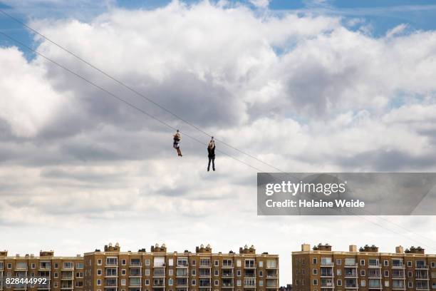 two persons on a zipline