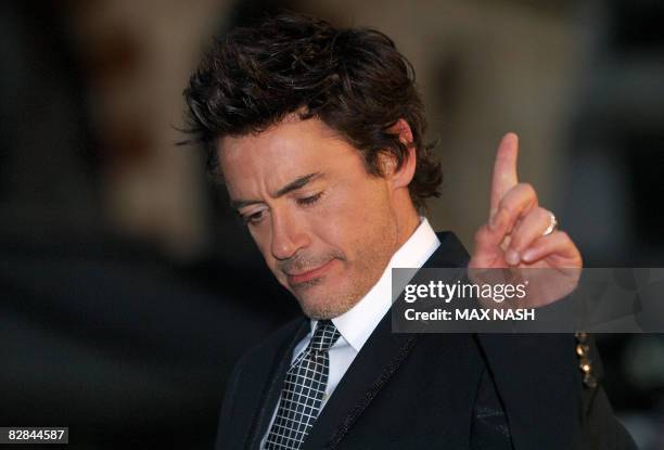 Actor Robert Downey Jnr. Gestures as he arrives in Leicester Square, London on September 16, 2008 to attend the British premiere of his latest film...