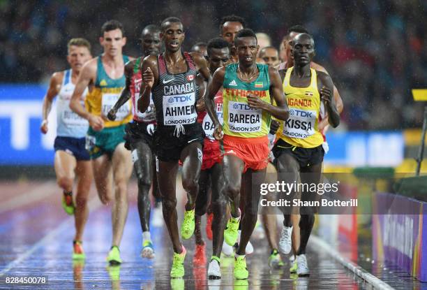 Selemon Barega of Ethiopia leads from Stephen Kissa of Uganda and Mohammed Ahmed of Canada during heat two of the Men's 5000 Metres heats during day...