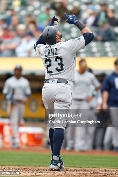 Nelson Cruz of the Seattle Mariners celebrates a two-run home run in the third inning against the Oakland Athletics at Oakland Alameda Coliseum on...