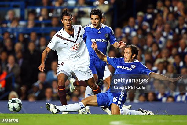 Ricardo Carvalho of Chelsea tackles Marouane Chamakh of Bordeaux during the UEFA Champions League Group A match between Chelsea and Bordeaux at...