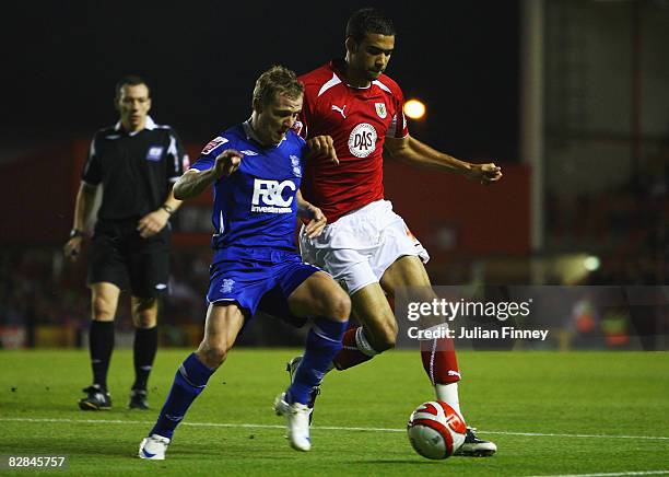 Gary McSheffrey of Birmingham battles with Liam Fontaine of Bristol during the Coca-Cola Championship match between Bristol City and Birmingham City...