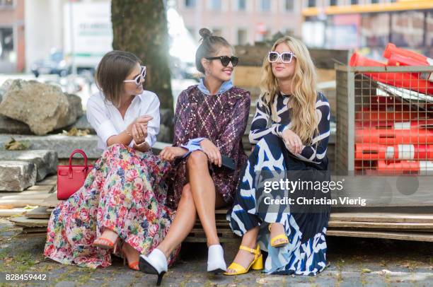 Darja Barannik wearing a dress and Emili Sindlev talking outside Munthe on August 09, 2017 in Copenhagen, Denmark.