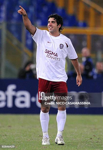 Cluj's Juan Culio celebrates after scoring a second goal against AS Roma during their Champions League Group A match on September 16, 2008 in Rome....