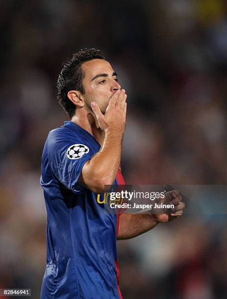 Xavi Hernandez of Barcelona celebrates his goal during the UEFA Champions League Group C match between Barcelona and Sporting Lisbon at the Camp Nou...